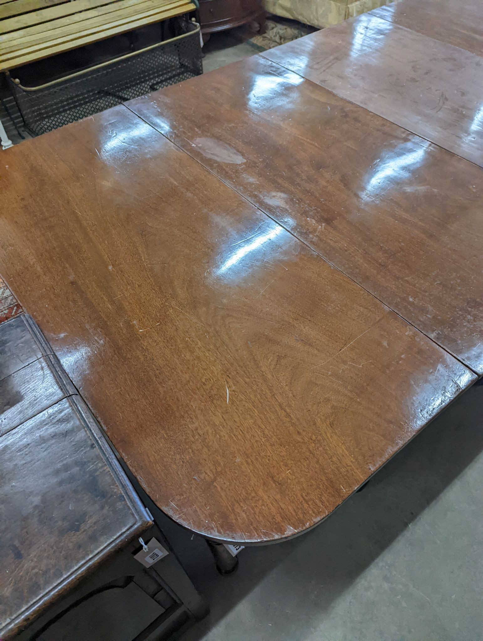 A George IV mahogany D end drop leaf extending dining table, 266cm extended, width 121cm, height 74cm